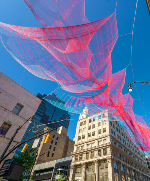 'current', the translucent fiber tapestry by janet echelman, sways and levitates over columbus