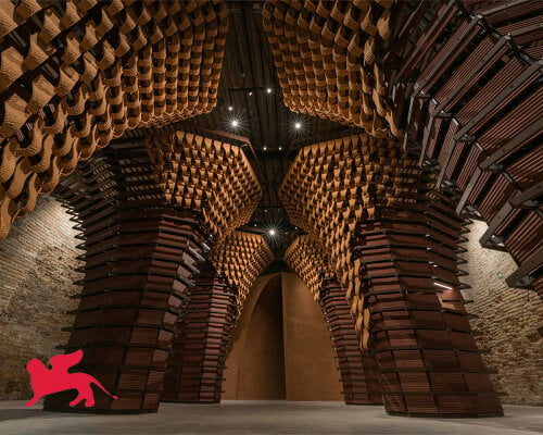 dramatic wood and clay sculptures engulf the saudi pavilion at venice architecture biennale